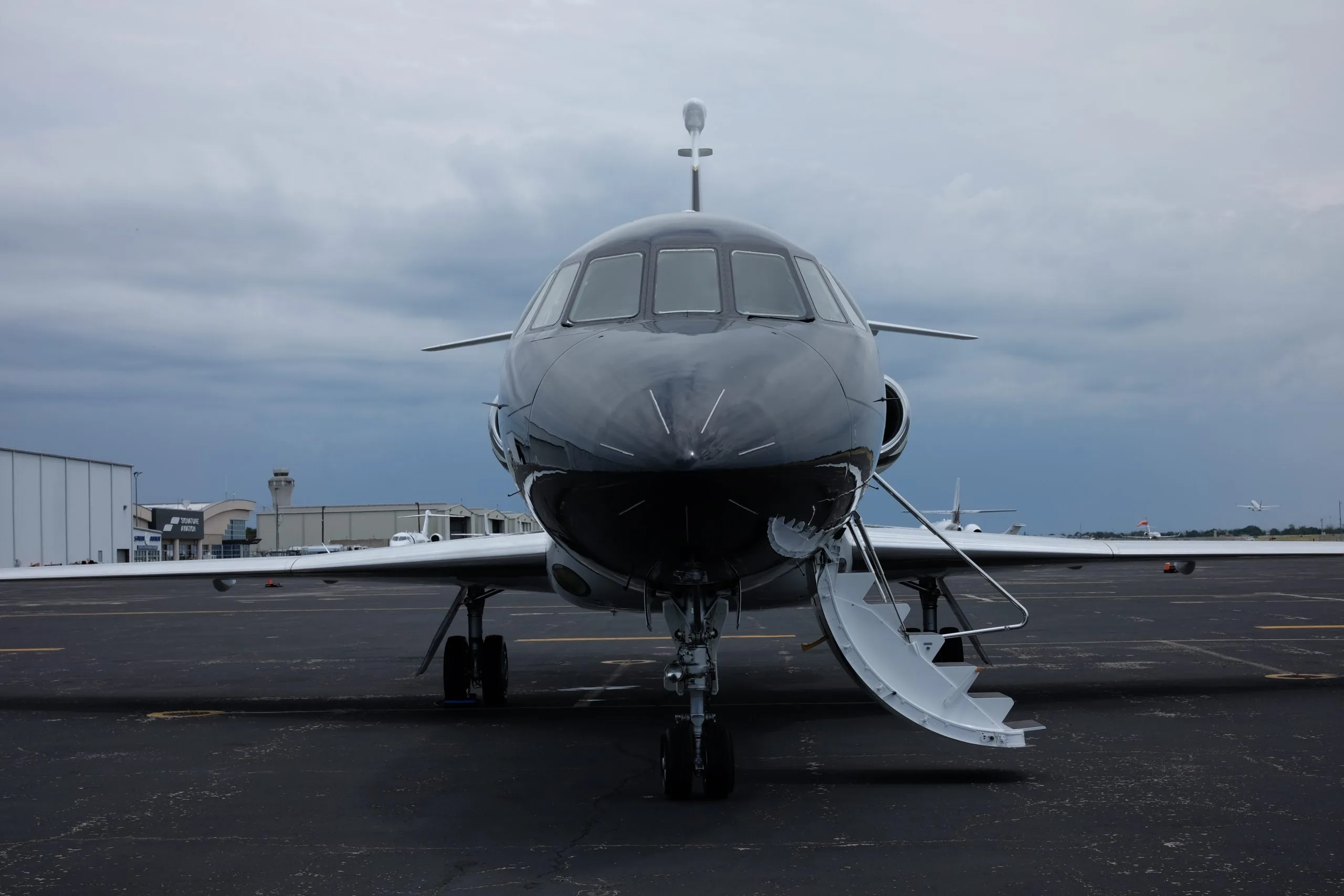 Falcon 900EX N608LC front view with airstairs deployed